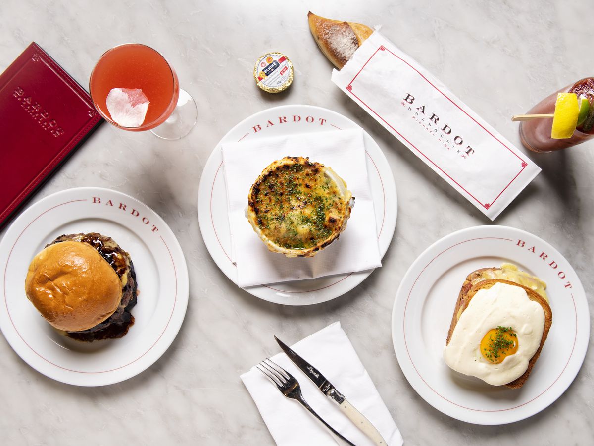 A spread of dishes, including a burger and baguette, at Bardot Brasserie