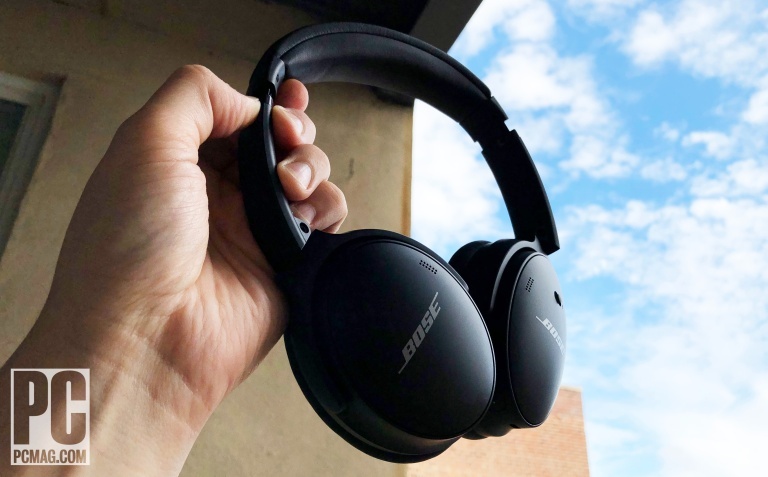 The Monoprice-BT-600 ANC noise canceling Bluetooth headphones in front of a house plant.