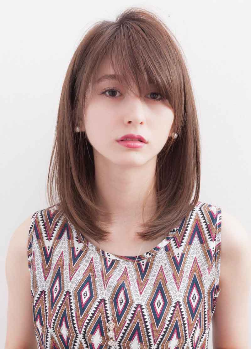 Kiểu tóc layer nữ mặt tròn dài